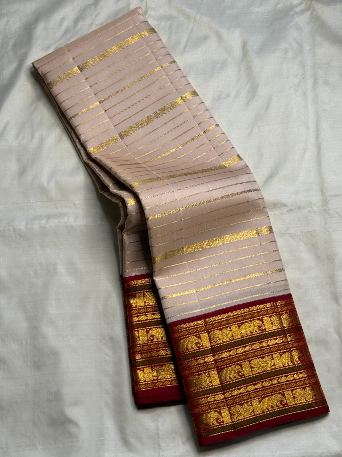 Kamadhenu pallu on a pearl pink Varisaipet Pure Silk Kanchipuram saree