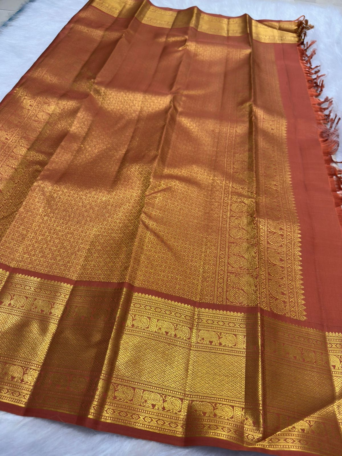 Gold zari detail of Kamalam and Mayil buttas, warm-ivory Kanjipuram Korvai saree