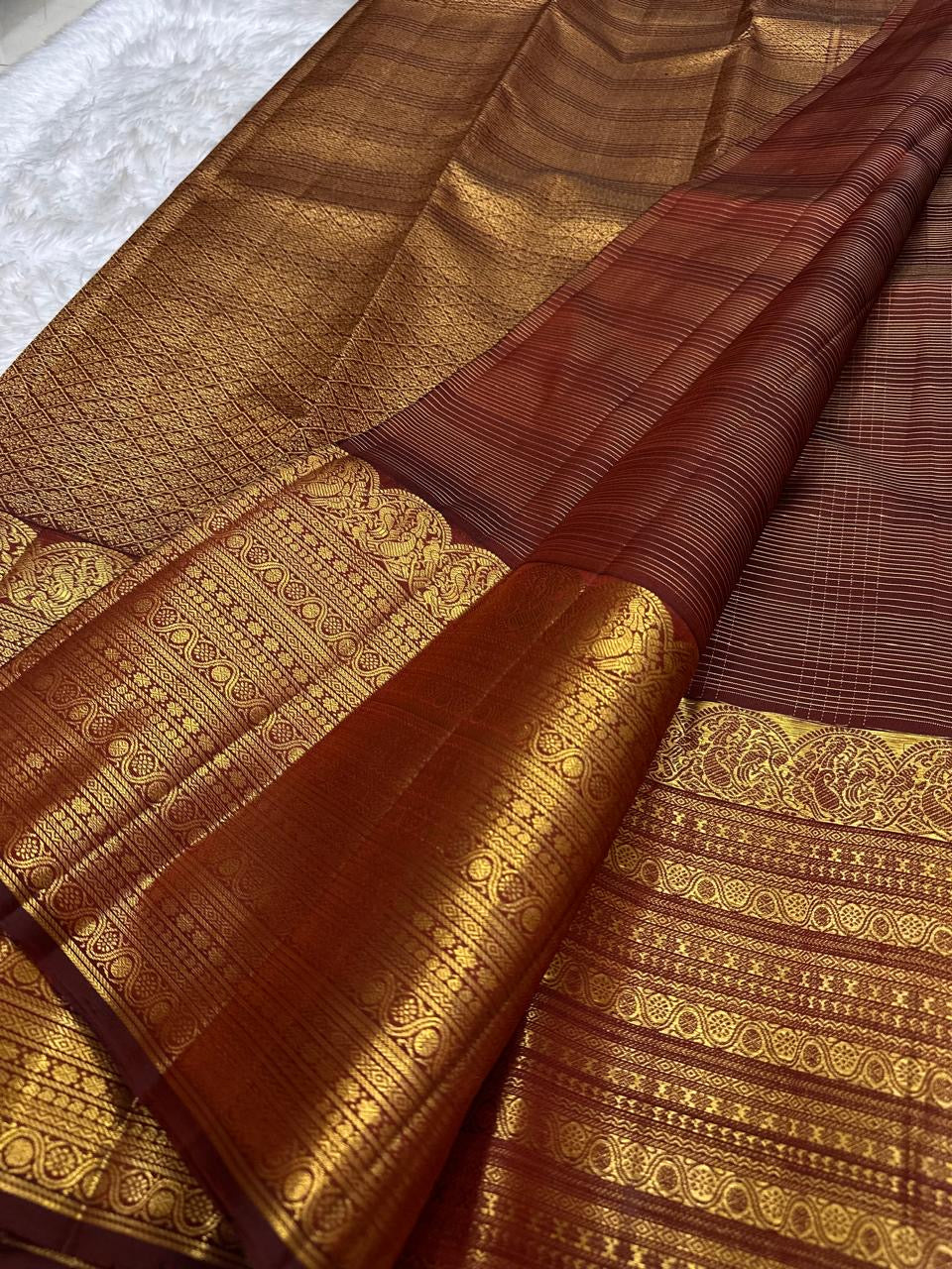 Cinnamon Rustic Brown Pure Silk Kanchipuram Zari Kattam saree with richly worked classic-gold border.