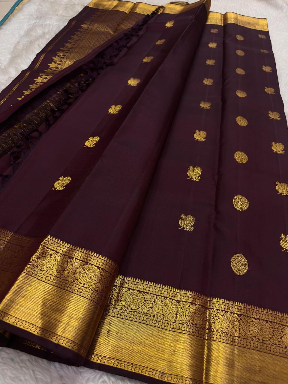 Kanchana brown Kanjivaram silk saree with mayil chakram butta – body weave detail