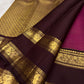 Close view of antique-gold checked zari weaving across Raspberry Magenta Kanjivaram silk.