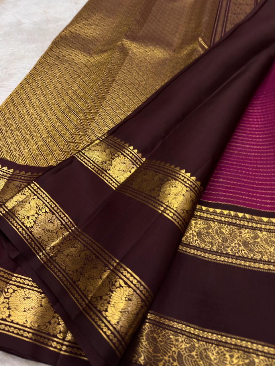 Close view of antique-gold checked zari weaving across Raspberry Magenta Kanjivaram silk.
