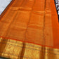 Orange Kanchipuram border with large repeating Mayil figures woven in gold zari.