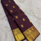 Kanchana brown purple Kanchipuram saree with ornate mayil kodi border – front drape view