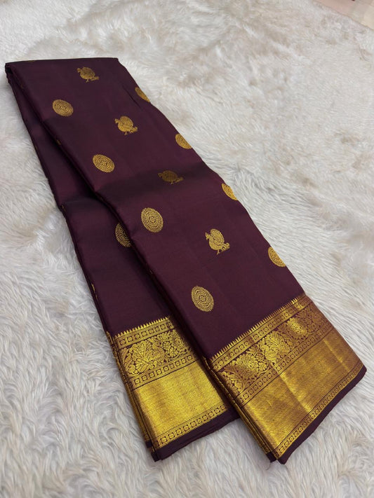 Kanchana brown purple Kanchipuram saree with ornate mayil kodi border – front drape view