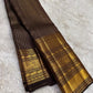 Handwoven Kanjeevaram saree featuring bronze Kanchana brown body with 2 gram zari purity weaving