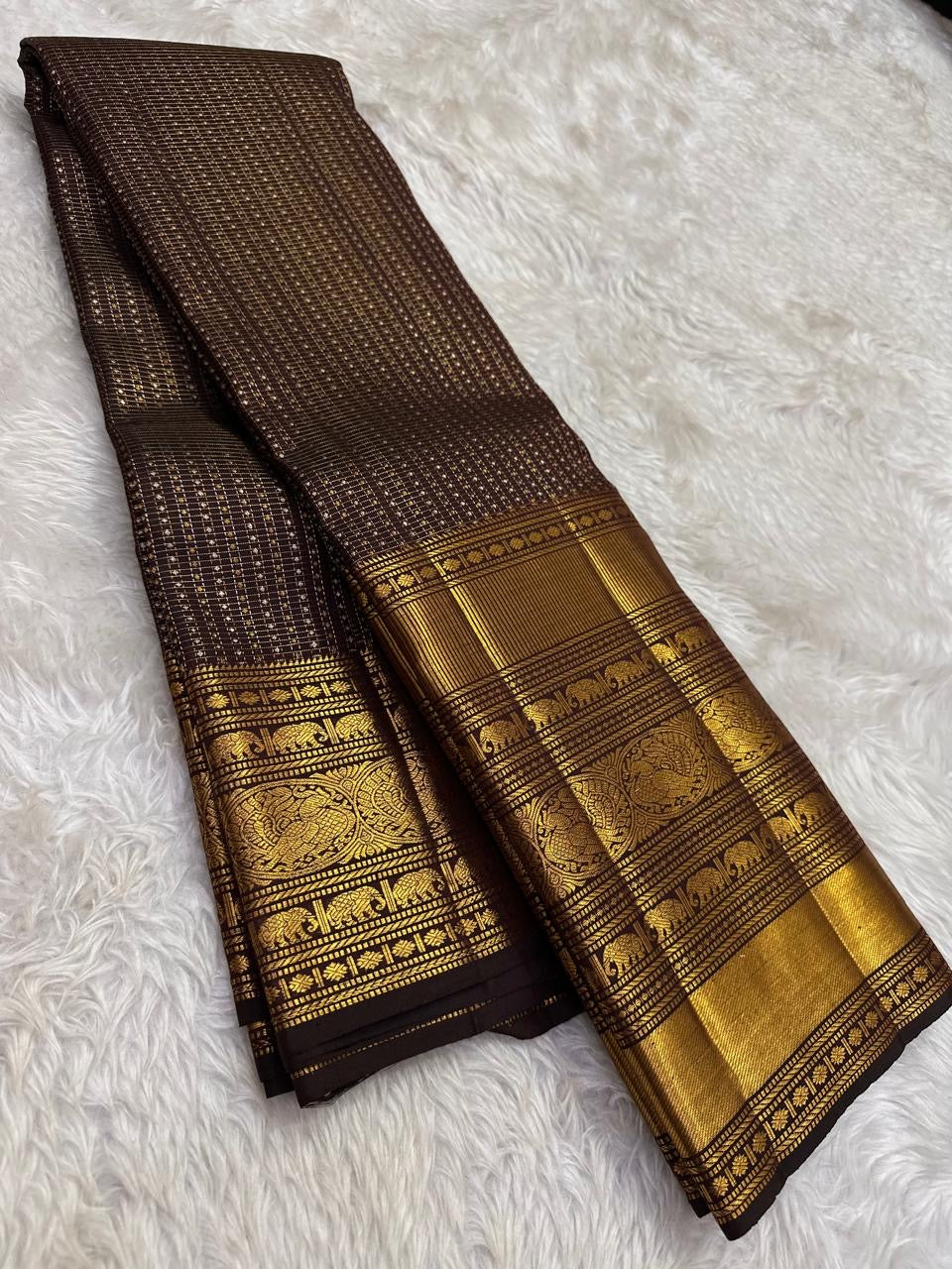 Handwoven Kanjeevaram saree featuring bronze Kanchana brown body with 2 gram zari purity weaving