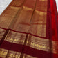 Arakku Red Kanchipuram border with traditional antique-gold Mayil motifs.