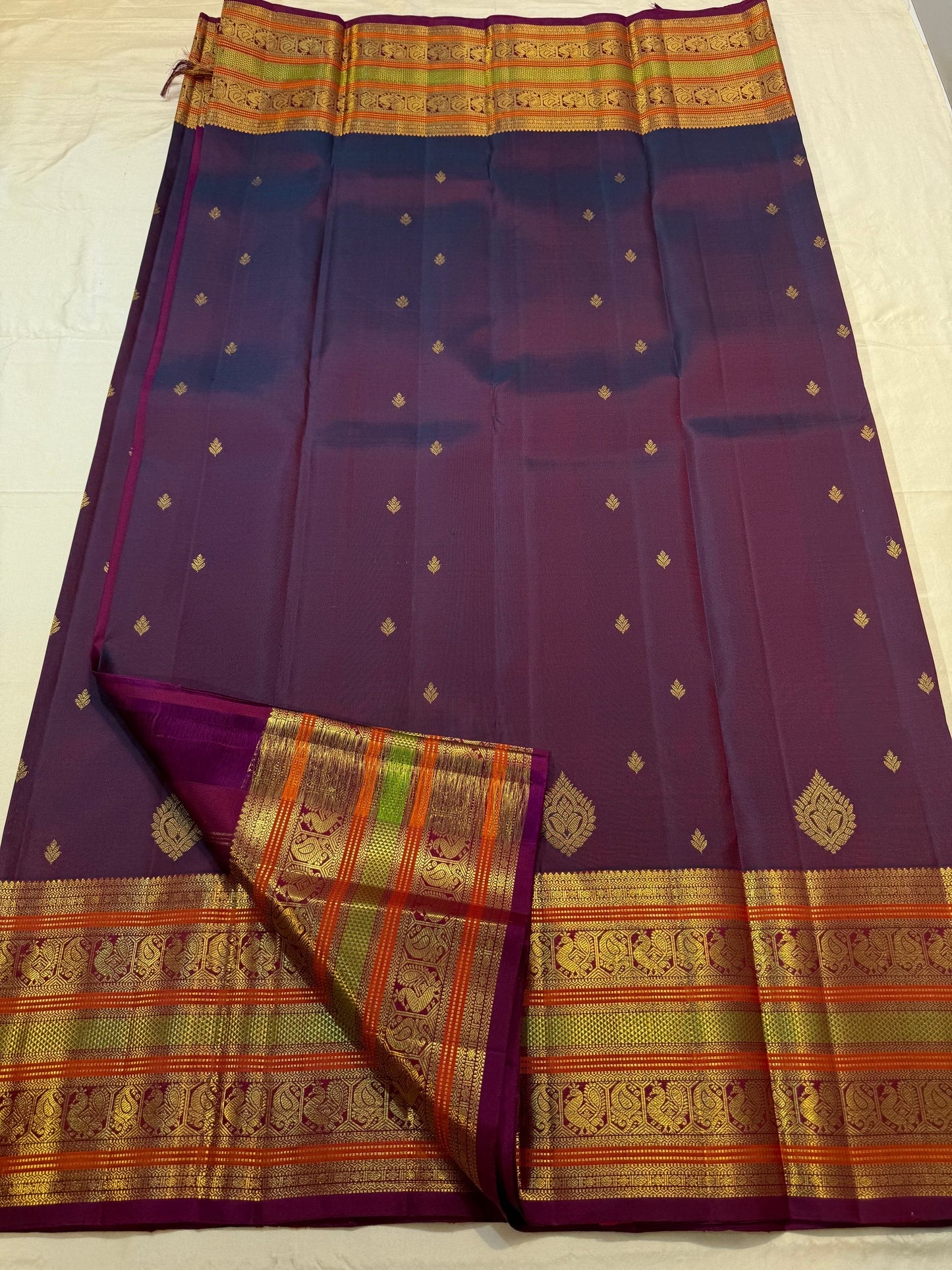 Multi-colour border close-up on magenta double shade pure silk Kanchipuram saree — Idam Living