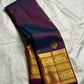 Close-up of maanga butta in gold zari on magenta double shade Kanjeevaram silk saree — Idam Living