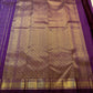 Close view of fine gold zari checks woven across deep Kanchana Purple pure silk.