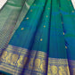 Peacock Blue, emerald green, royal blue and antique gold handwoven Kanchipuram butta silk saree, border zari detail, with gold zari detailing.