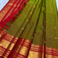 red border detail of olive green Kanchipuram silk saree