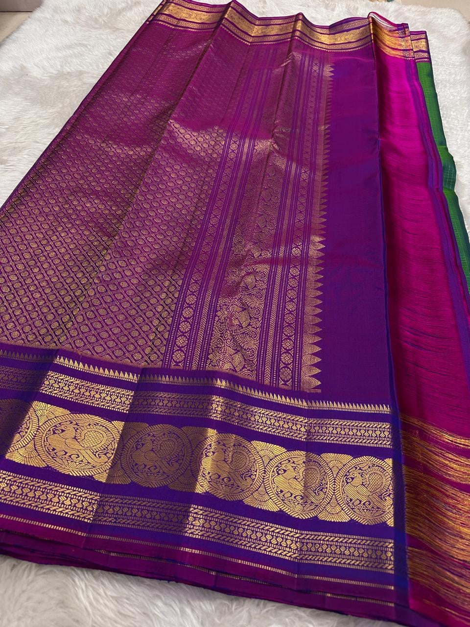 violet border detail of peacock green Kanchipuram silk saree