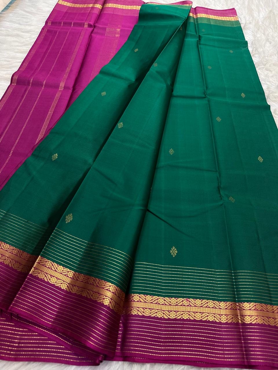 Emerald Green and Vadamalli Magenta lightweight Kanchipuram silk saree, spaced buttas and scrolling floral zari border; full layout