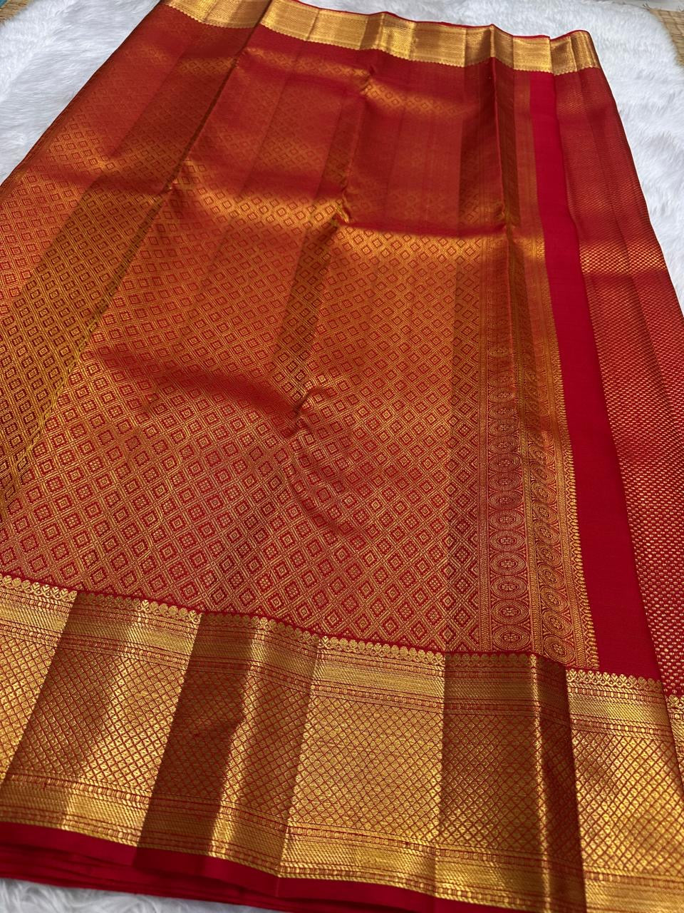 zk pallu detail of vermilion red Kanchipuram silk saree