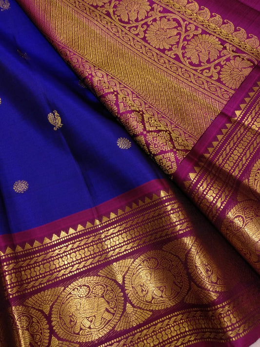 Blue Kanchipuram silk saree with gold buttas and peacock zari border full view