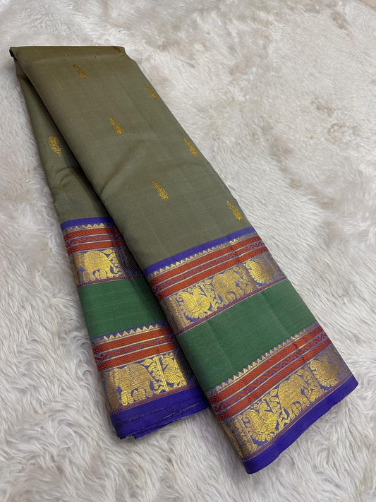 Olive green Kanchipuram silk saree with azure blue border folded view