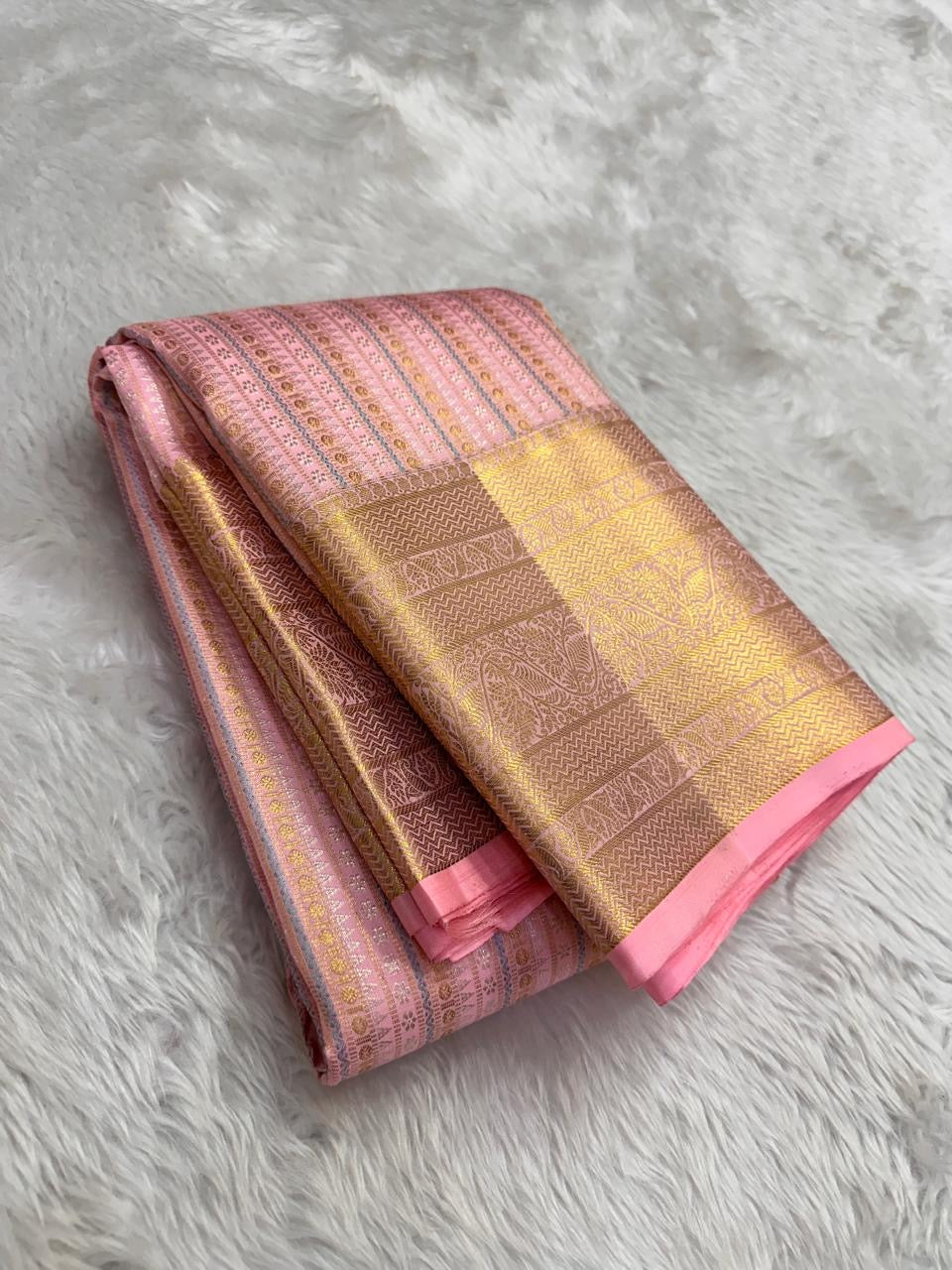 Petal pink Kanchipuram silk saree with apricot border folded view