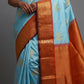 Sky blue pure Kanchipuram silk saree with pichwai cow motif and antique gold zari border folded view