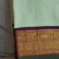 Pure Kanjeevaram pastel silk saree flat lay showing refined vairaoosi zari detailing