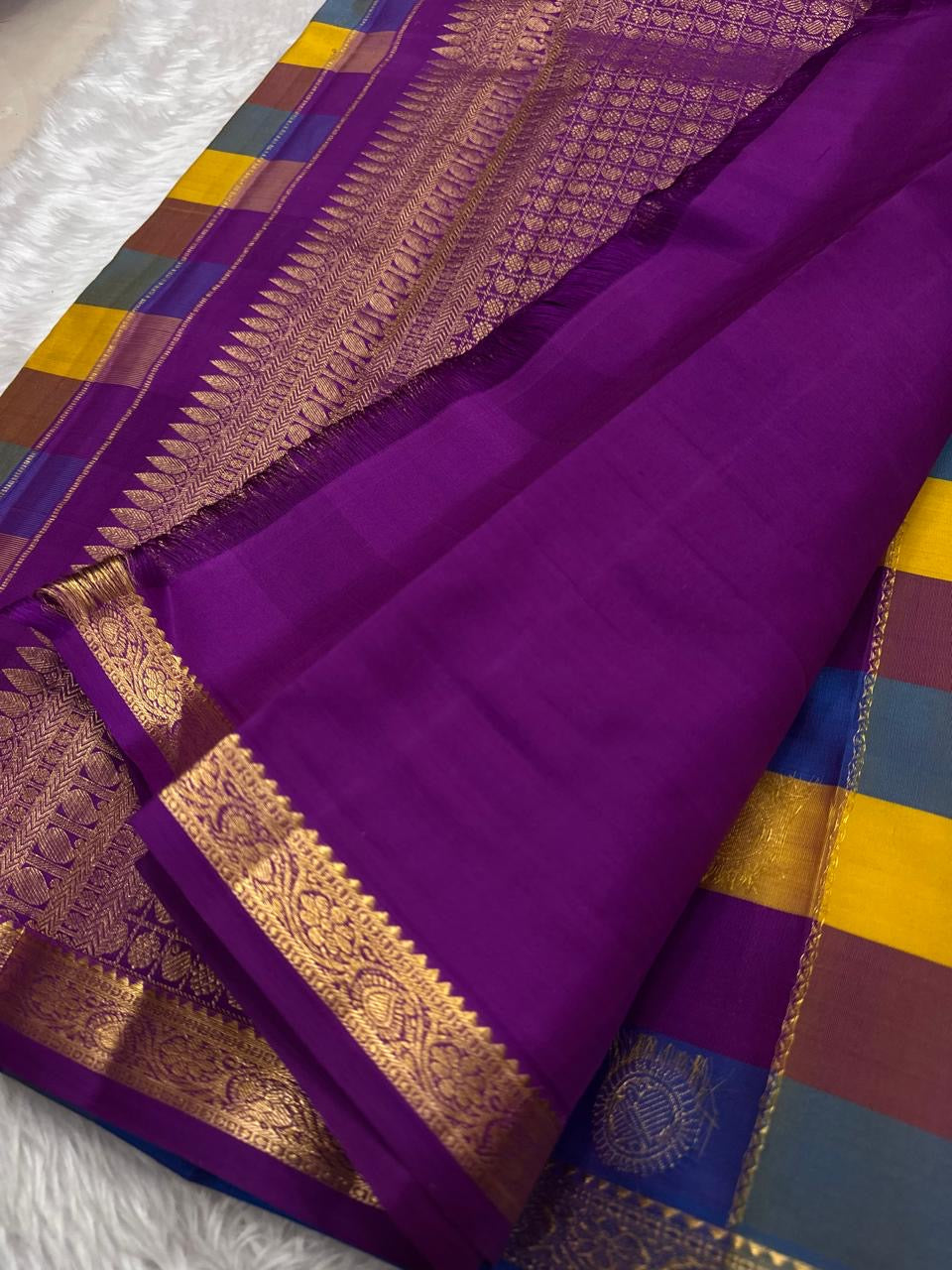 Multicolor check Kanchipuram silk saree border detail with traditional gold zari work