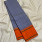 Navy white Kancheepuram silk saree body close-up showing fine navy and white intersecting silk thread checkered grid
