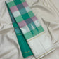 Paalum Pazhamum Kanjivaram silk saree body close-up showing vibrant emerald teal mint pink mauve multicolour check weave