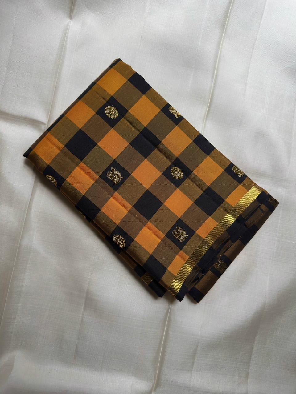 Turmeric Yellow Kanchi Kattam saree with black checks and gold zari buttas
