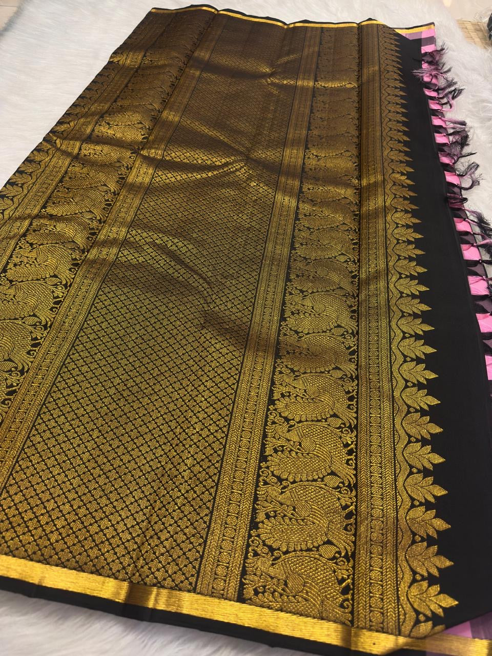 Rose Pink Kanchi Kattam saree with Black checks and antique gold zari buttas