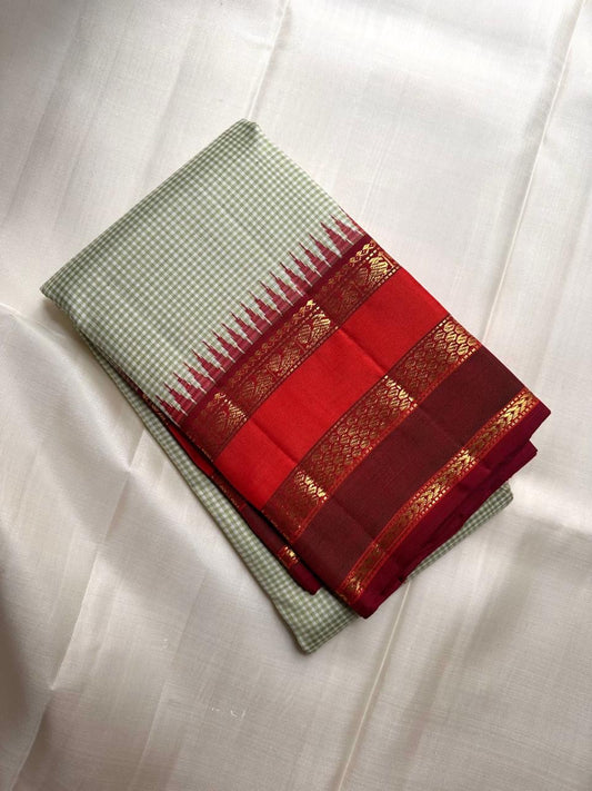 Close-up of sage green Kanchi Kattam silk checks on Kanjivaram saree body