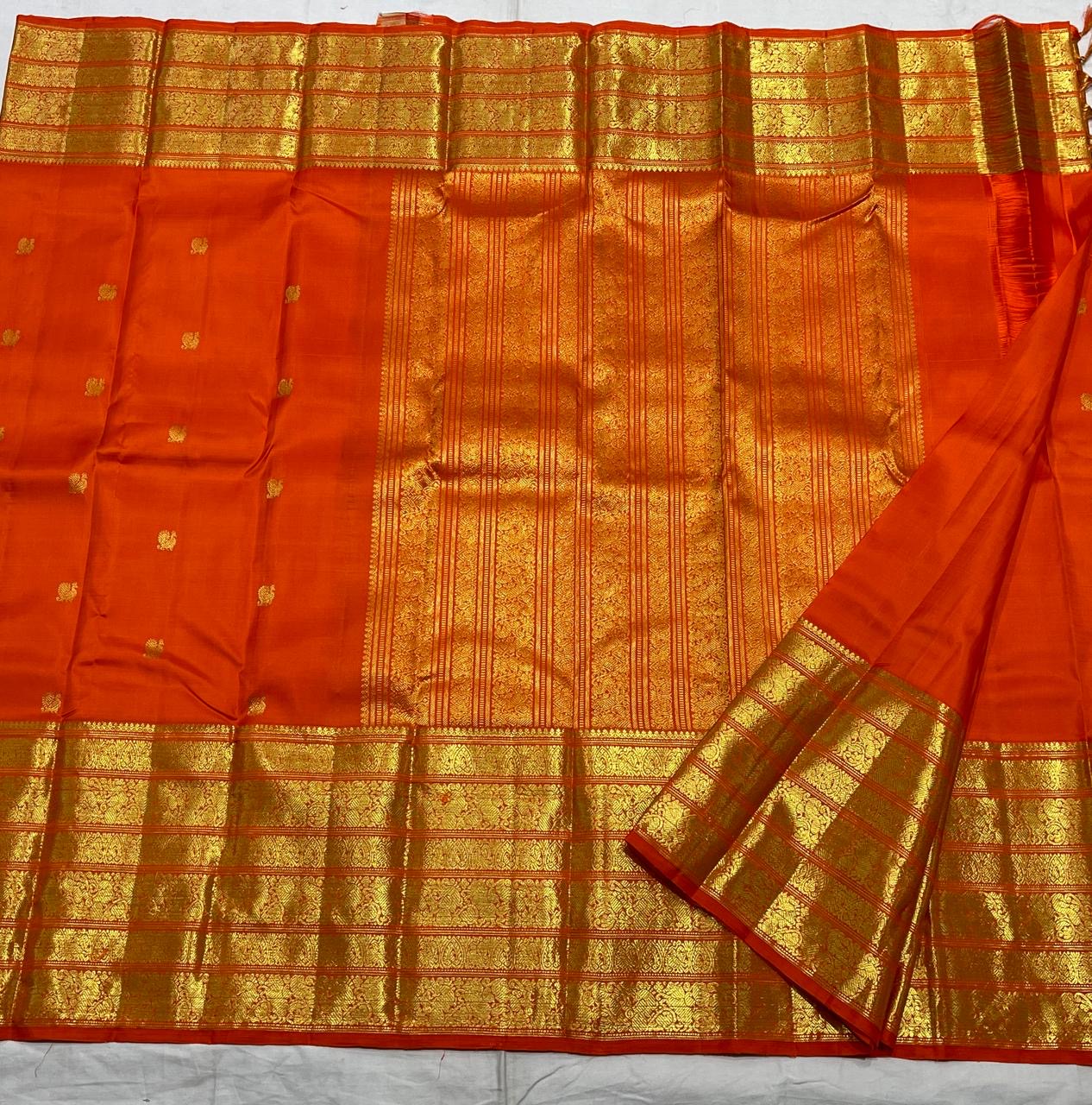 Orange handwoven pure silk Kanchipuram Varisaipet saree — close view of the body weave and texture