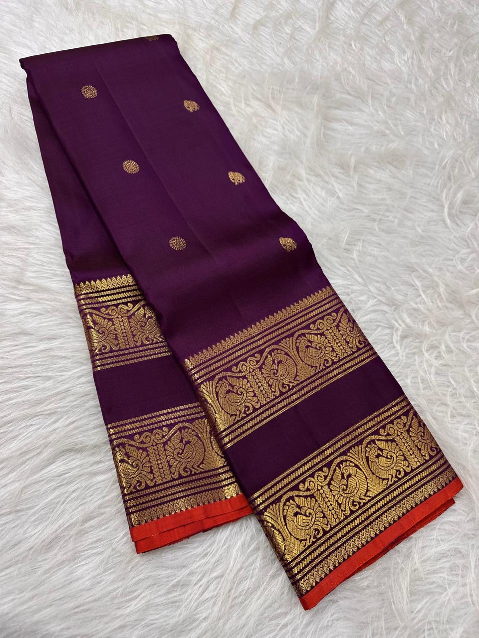 Double gold zari bands and orange selvedge on the deep purple Pure Silk Kanchipuram saree