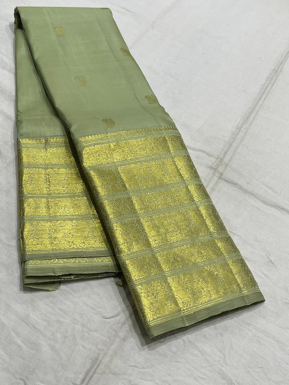 Sage green handwoven pure silk Kanchipuram Varisaipet saree — detail of the saree border
