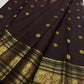 Coffee brown pure silk Kanchipuram saree with antique gold mayil chakram buttas, deep green accents, and a detailed peacock and arai maadam pallu, view 6.