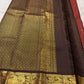 Close view of gold zari kattam checks and tiny buttas on vermilion red pure silk Kanchipuram saree body