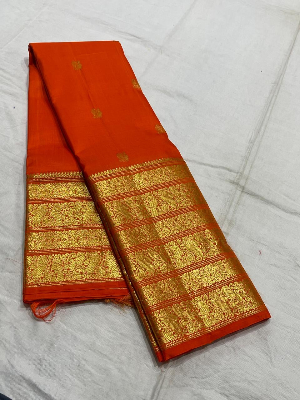 Orange handwoven pure silk Kanchipuram Varisaipet saree — overview of the full saree drape
