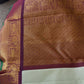 Light pastel Kanjivaram silk saree texture closeup highlighting shifting sheen of vairaoosi weave