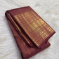 Traditional Annam sacred-bird motifs in antique-gold zari panels on Earthy Rose Kanchipuram silk