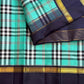 Lagoon turquoise Paapli checks pure silk Kanchipuram saree with midnight navy Rettapet border and gold Seer pallu, Idam Living (photo 1 of 5)