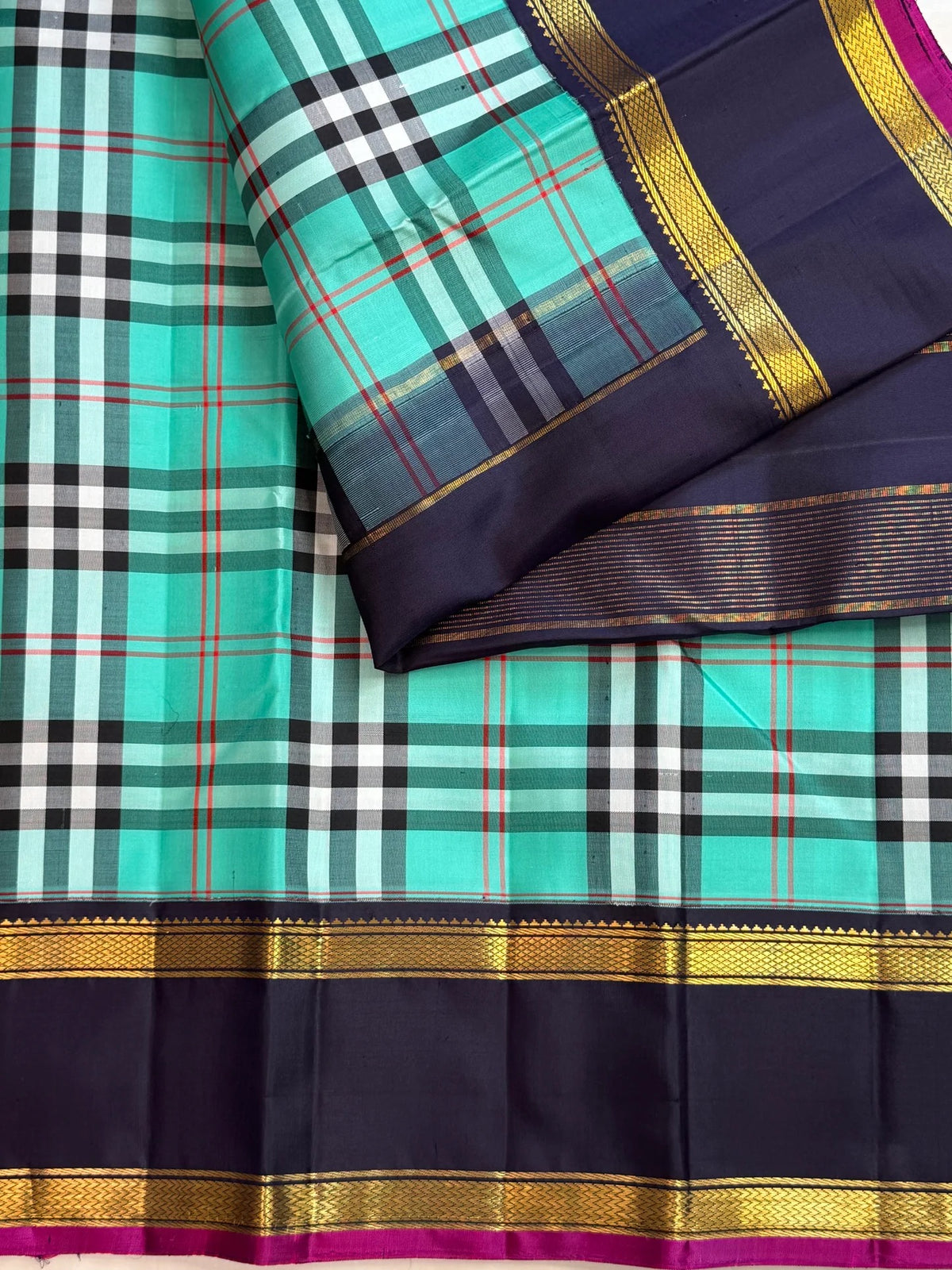 Lagoon turquoise Paapli checks pure silk Kanchipuram saree with midnight navy Rettapet border and gold Seer pallu, Idam Living (photo 1 of 5)
