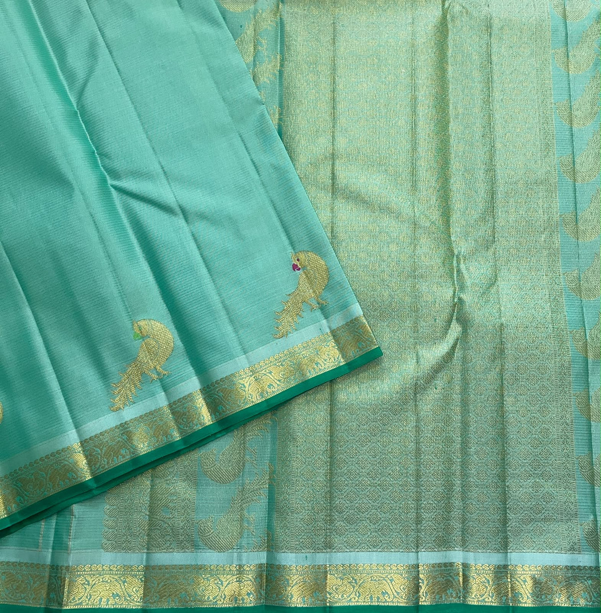 Seafoam turquoise Vairaoosi Kanchipuram silk saree with delicate gold zari peacock buttas and emerald green border