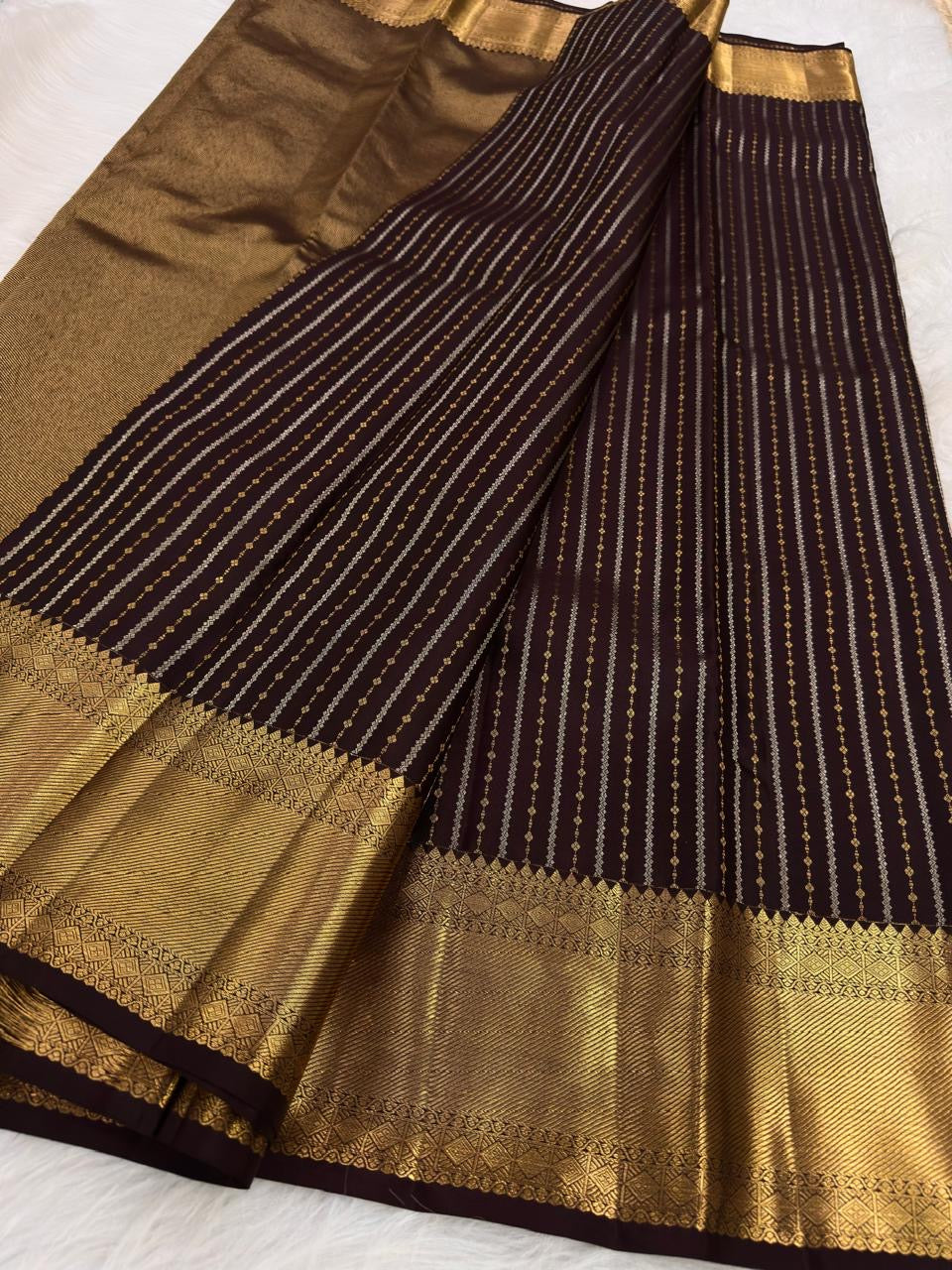 Aubergine handwoven pure silk KanchiPattu Butta saree — antique gold geometric temple border close-up — Idam Living