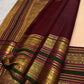 Soft peach ivory Kanchi Pattu saree body with gold buttas.