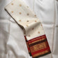 Ivory pure silk Kanchipuram saree, border selvedge detail with warm ivory with arakku-red, vermilion and manthulir-green accents