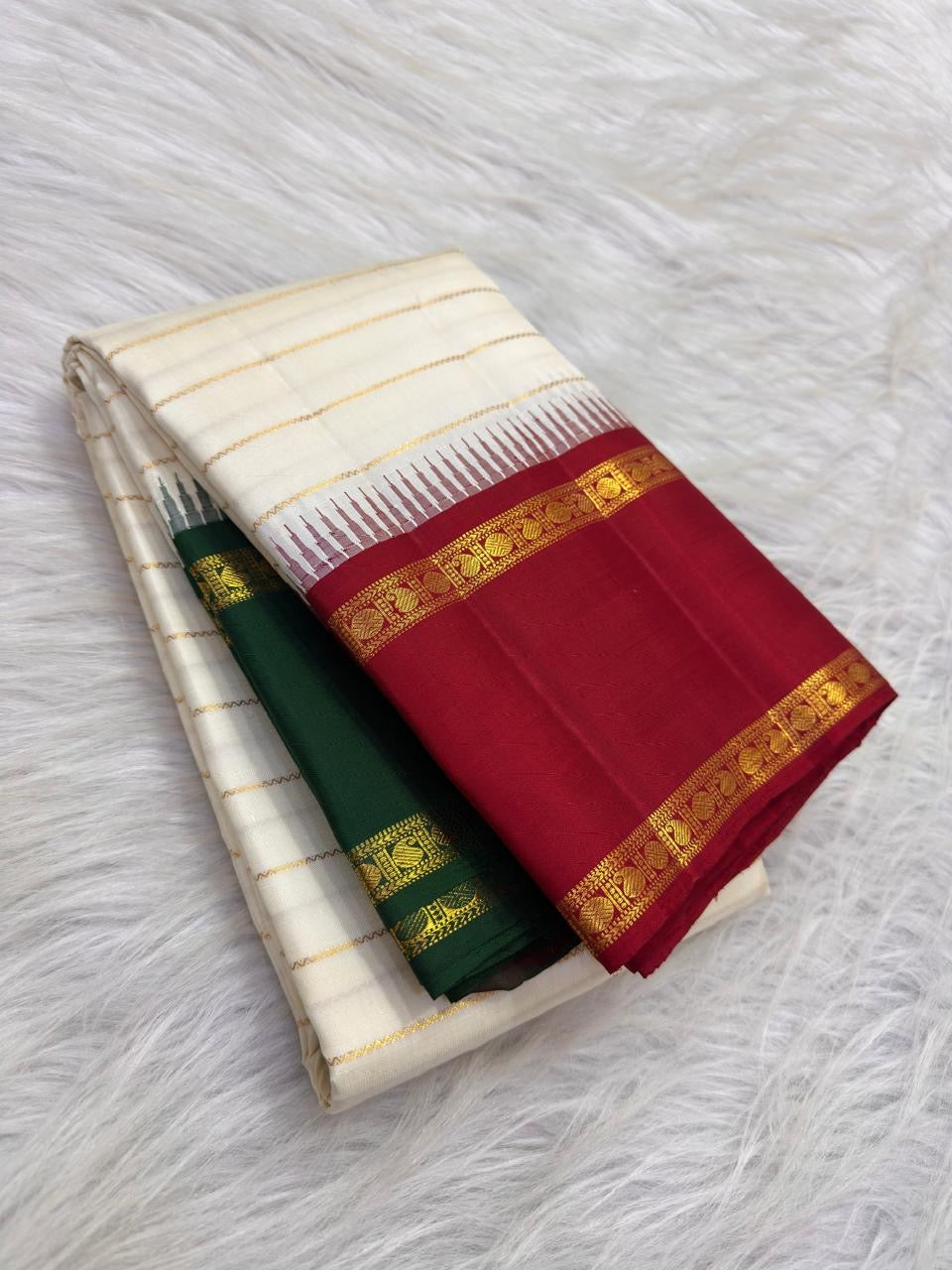 Ivory Kanchipuram silk saree with handwoven gold zari veldhari stripes and Ganga Jamuna border, styled for a temple annual festival.