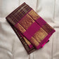 Oodha magenta Pure Kanchipuram Silk Zari Kattam saree worn by a wedding guest at a reception