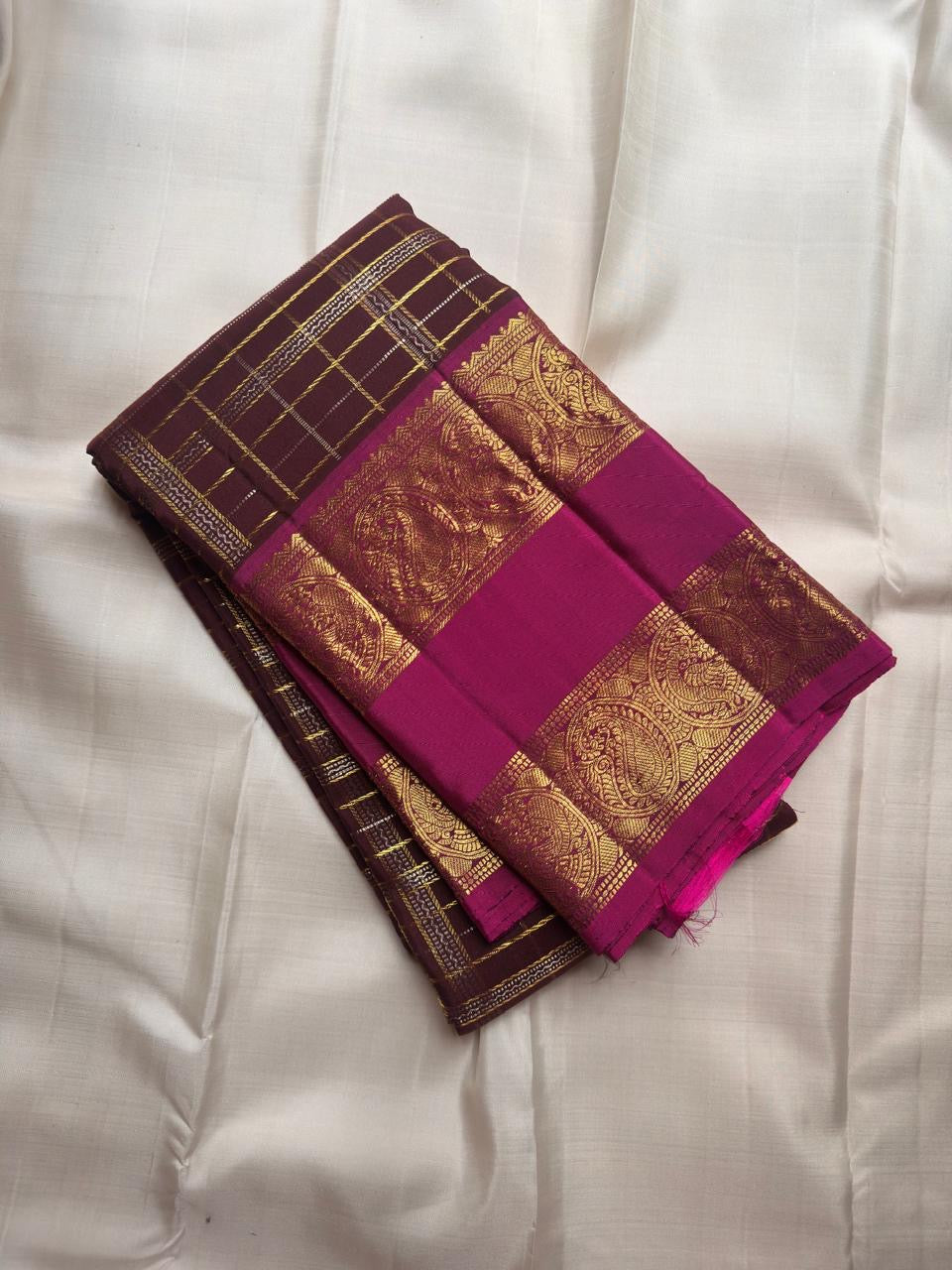 Oodha magenta Pure Kanchipuram Silk Zari Kattam saree worn by a wedding guest at a reception