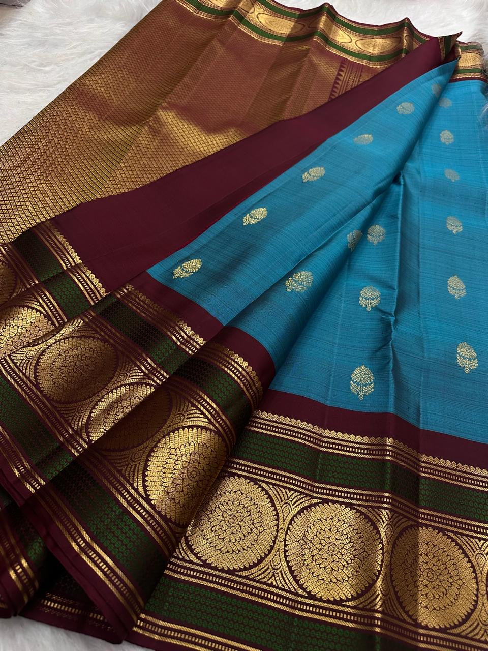 Grand Kamalam zari medallions in concentric lotus-petal geometry on Kanchipuram silk