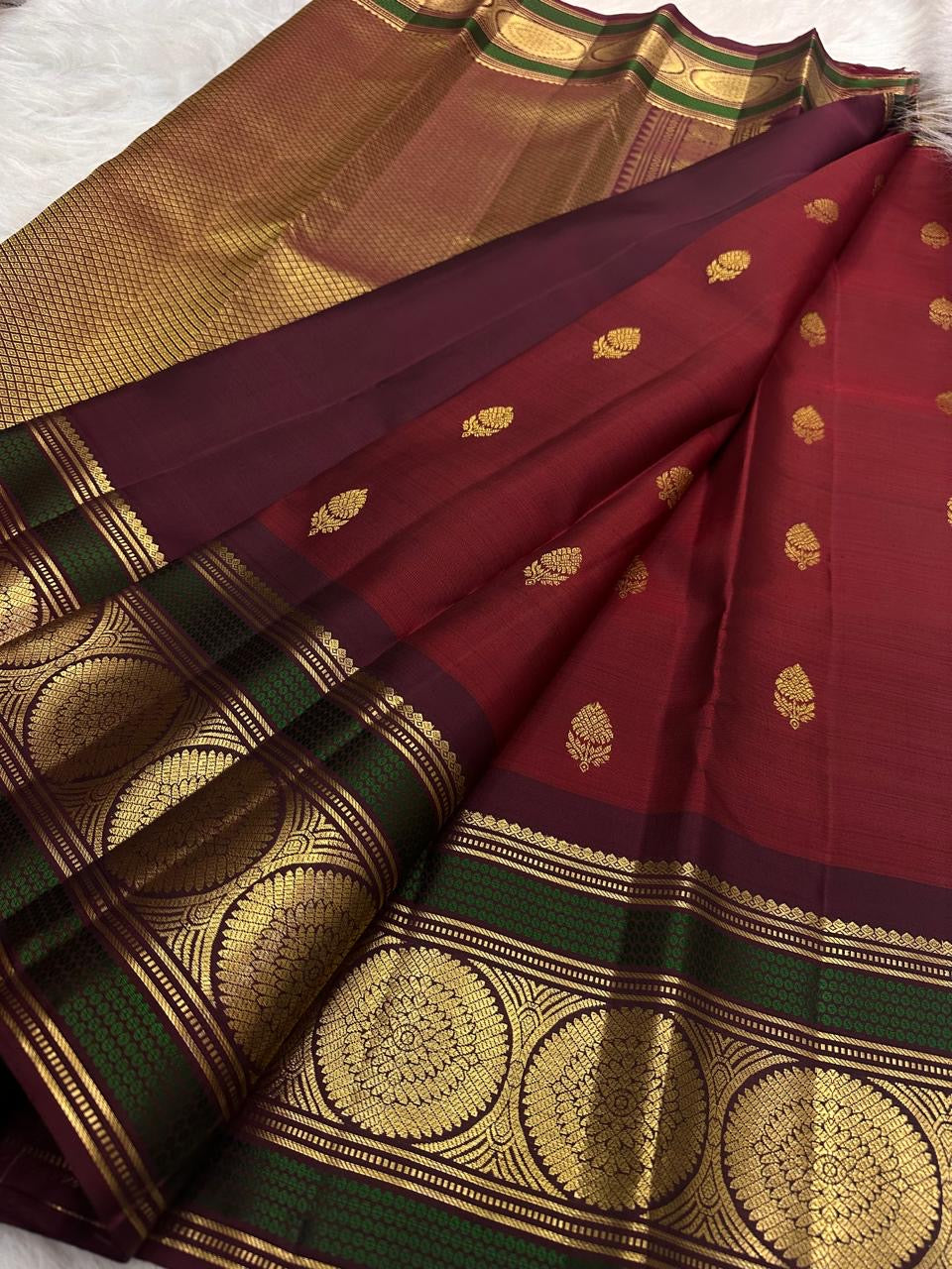 Grand Kamalam zari medallions woven in concentric lotus-petal geometry on Kanchipuram silk